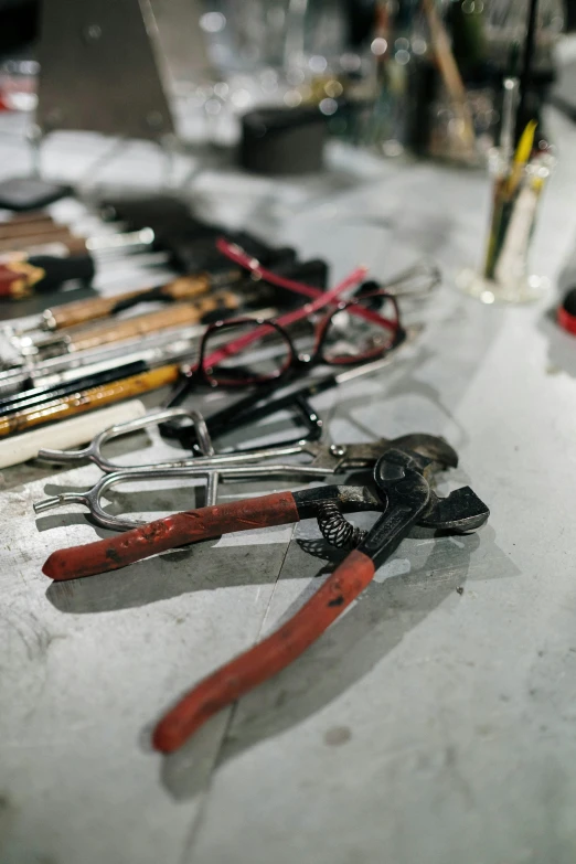 a bunch of tools sitting on top of a table, specimens in glasses, shaft studio, the backroom, off - white collection