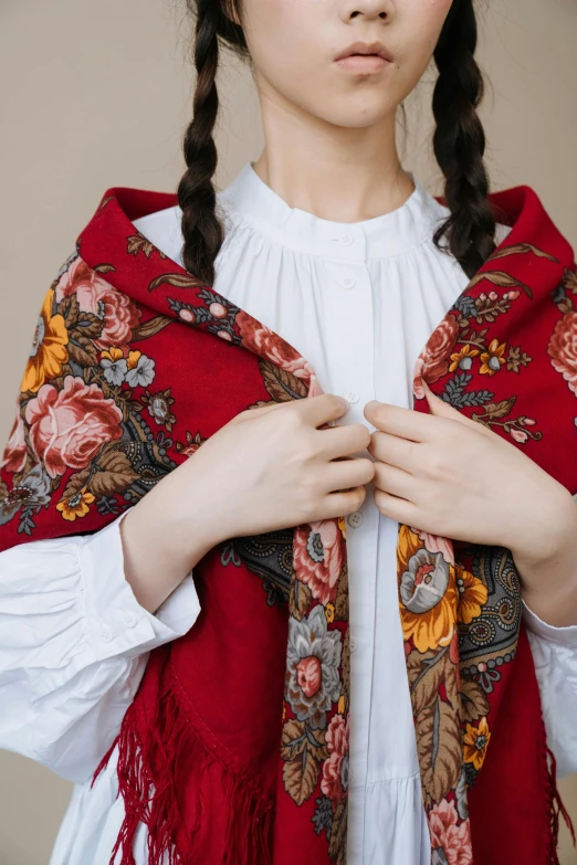 a woman with braid hair wearing a red shawl, inspired by Vasily Surikov, trending on unsplash, floral clothes, full frame image, made of fabric, lined in cotton