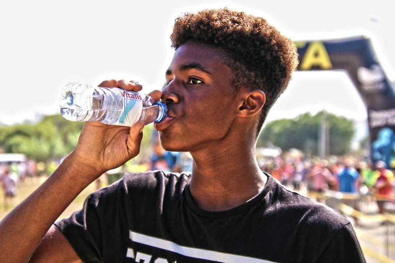 a young man drinking water from a plastic bottle, pexels contest winner, renaissance, black teenage boy, profile picture 1024px, festivals, sweaty 4 k