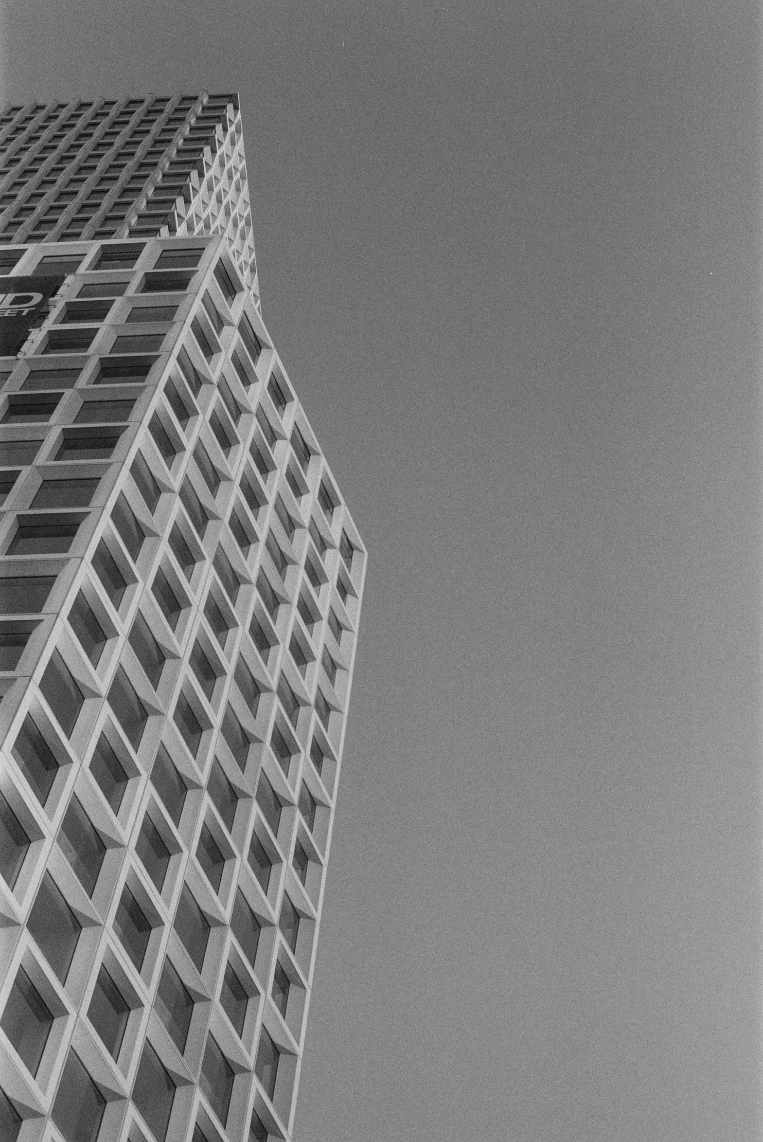 a black and white photo of a tall building, inspired by Ned M. Seidler, unsplash contest winner, tri - x pan stock, squares, midday photograph, photograph of san francisco