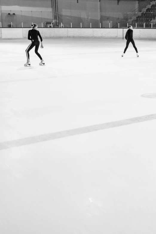 a group of people skating on an ice rink, a black and white photo, by Matthias Weischer, minimalism, 15081959 21121991 01012000 4k, instagram picture, olympics, trio