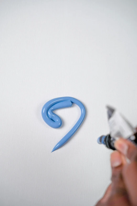 a person writing on a piece of paper with a pen, an airbrush painting, reddit, blue: 0.25, winding horn, thick impasto paint, set against a white background