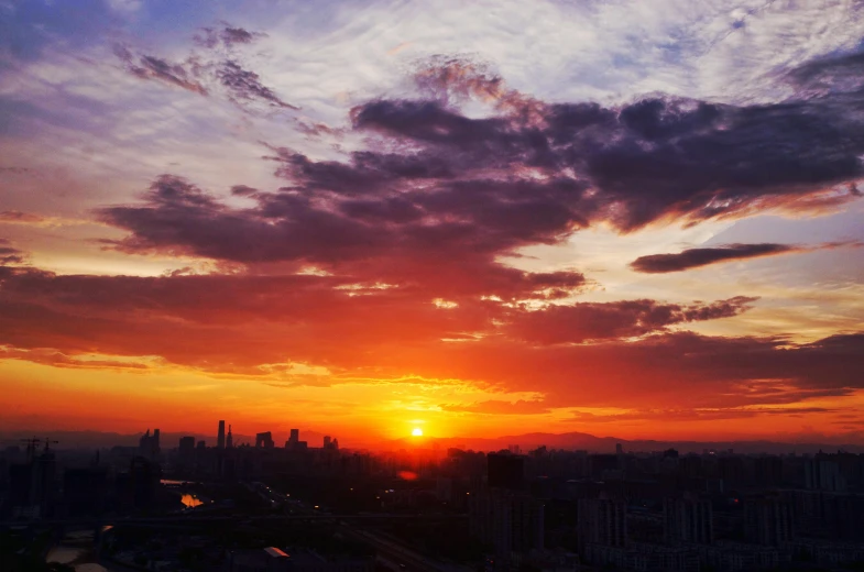 a view of the sun setting over a city, by Shang Xi, pexels contest winner, photo on iphone, sunset colors, goodnight, high detailed photo