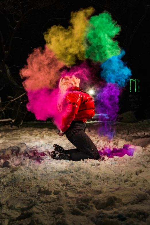 a person sitting in the snow with colored powder, by Julia Pishtar, drag light bombs, rainbow coloured rockets, in red paint, full dynamic colour