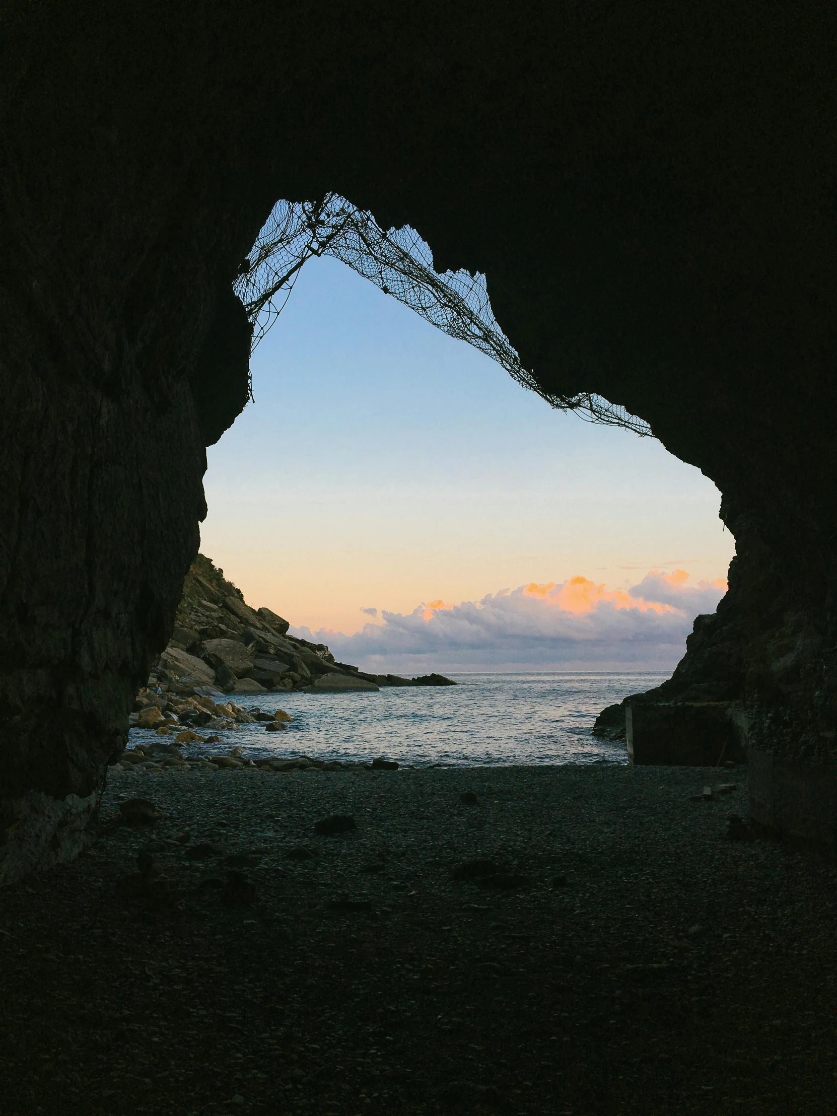a view of the ocean from inside a cave, by Jessie Algie, magic hour photography, cornwall, slide show, doorway
