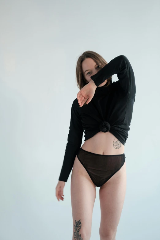 a woman in a black top is posing for a picture, unsplash contest winner, renaissance, panties, wearing a black sweater, anna nikonova aka newmilky, sheer