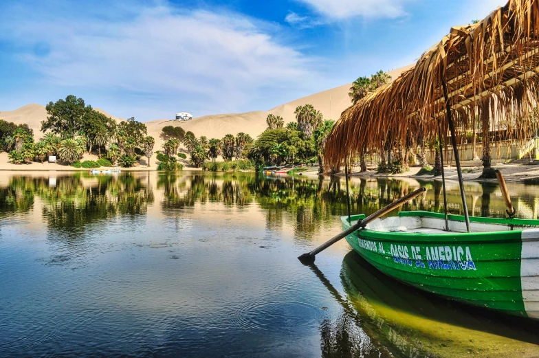 a green and white boat sitting on top of a lake, by Julia Pishtar, pexels contest winner, hurufiyya, standing next to desert oasis, tenochtitlan, canals, avatar image