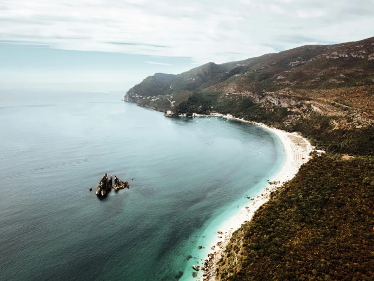 a large body of water next to a beach, by Lee Loughridge, unsplash contest winner, baroque, helicopter view, cape, tia masic, whealan