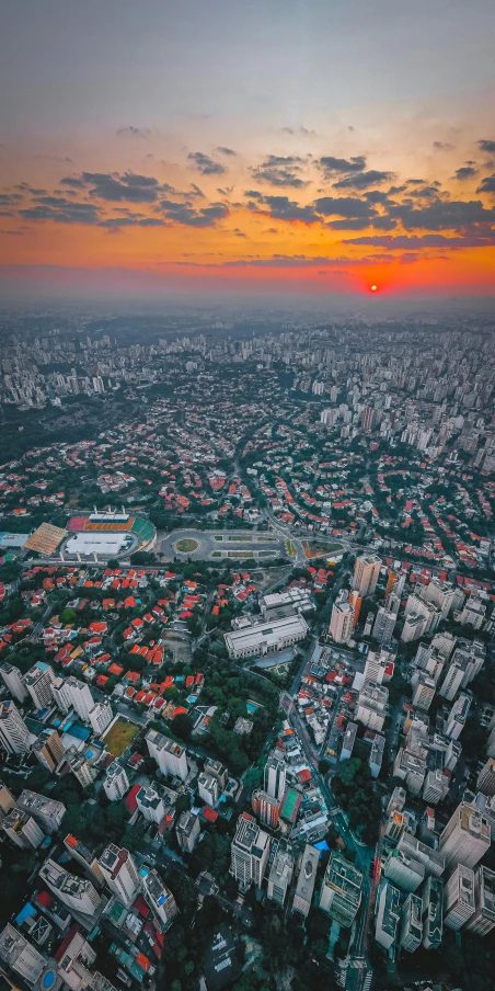 an aerial view of a city at sunset, by Joze Ciuha, pexels contest winner, solid background, shot on gopro9, high quality photo, cinematic. by leng jun