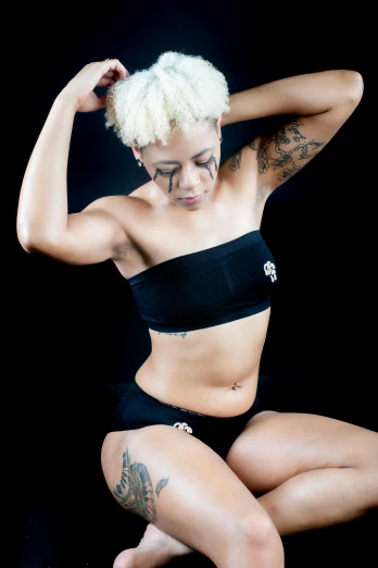a woman in a black bikini posing for a picture, a tattoo, inspired by Jessie Alexandra Dick, afrofuturism, yasuke 5 0 0 px models, croptop and shorts, high res photograph, intense white hair