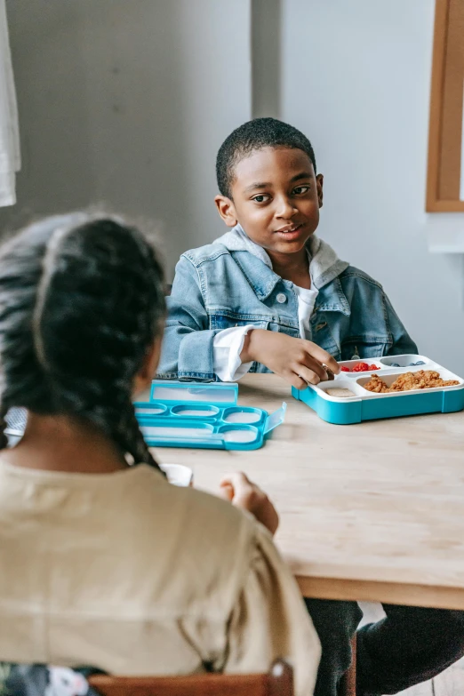 a group of children sitting at a table eating, pexels contest winner, american barbizon school, medium shot of two characters, diverse, teaching, 15081959 21121991 01012000 4k