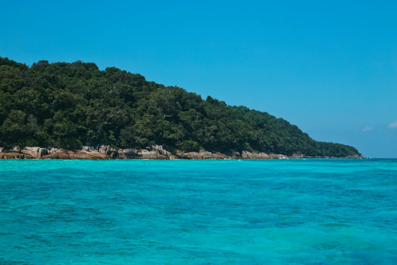 a small island in the middle of the ocean, an album cover, pexels contest winner, sumatraism, turquoise, malaysia jungle, warm shades of blue, 8 1 5