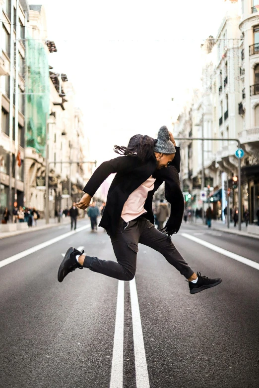 a man flying through the air while riding a skateboard, pexels contest winner, happening, walking down a street, jumping for joy, in spain, wearing urban techwear