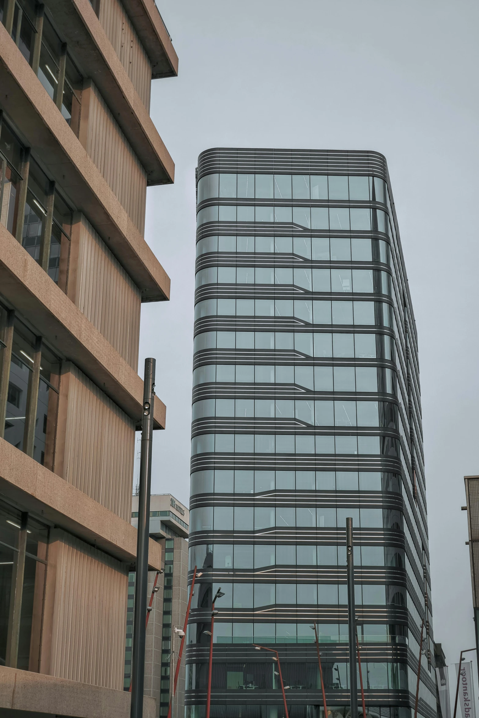 a very tall building sitting in the middle of a city, inspired by David Chipperfield, flickr, wellington, side view of a gaunt, slight overcast, hoog detail