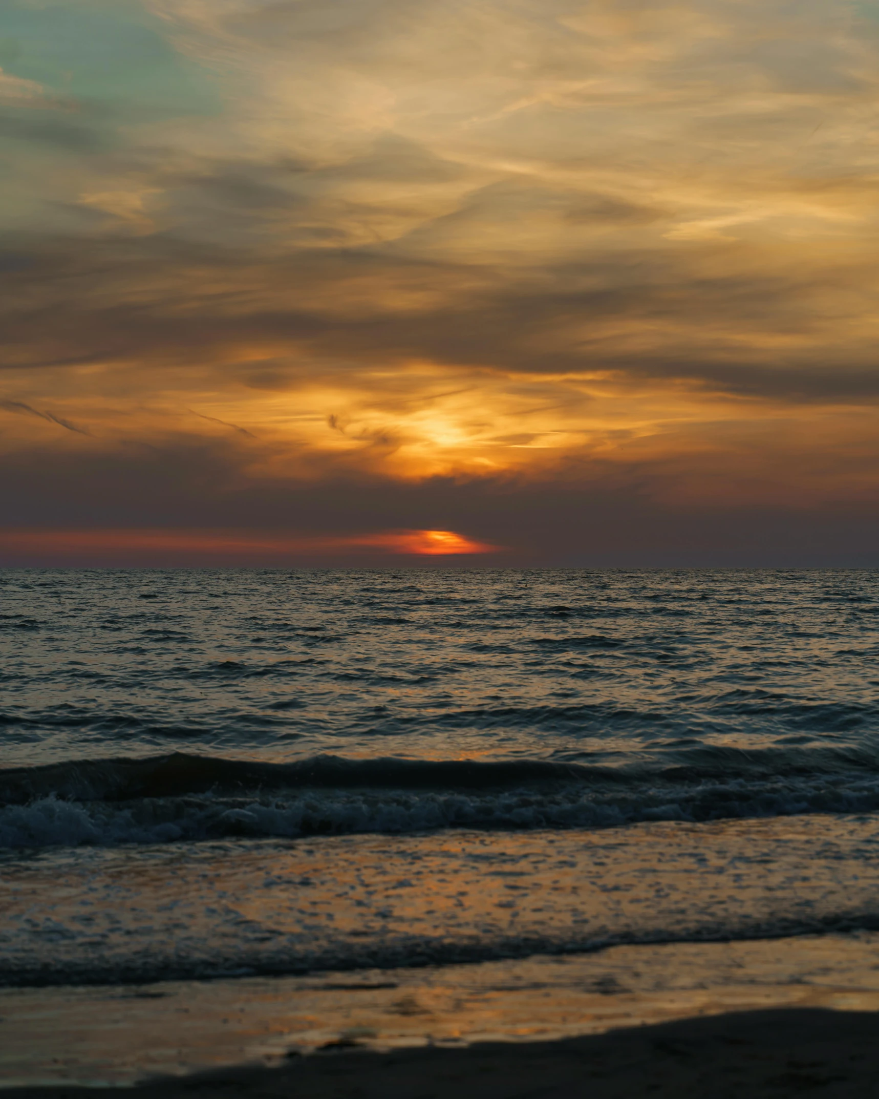 a man flying a kite on top of a sandy beach, a picture, unsplash contest winner, romanticism, ((sunset)), black sea, today\'s featured photograph 4k, large twin sunset