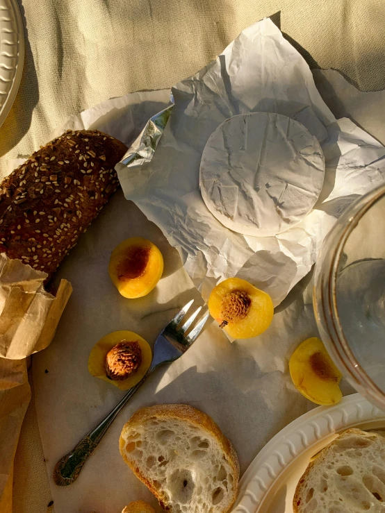 a close up of a plate of food on a table, in the sun, cheeses, detailed product image