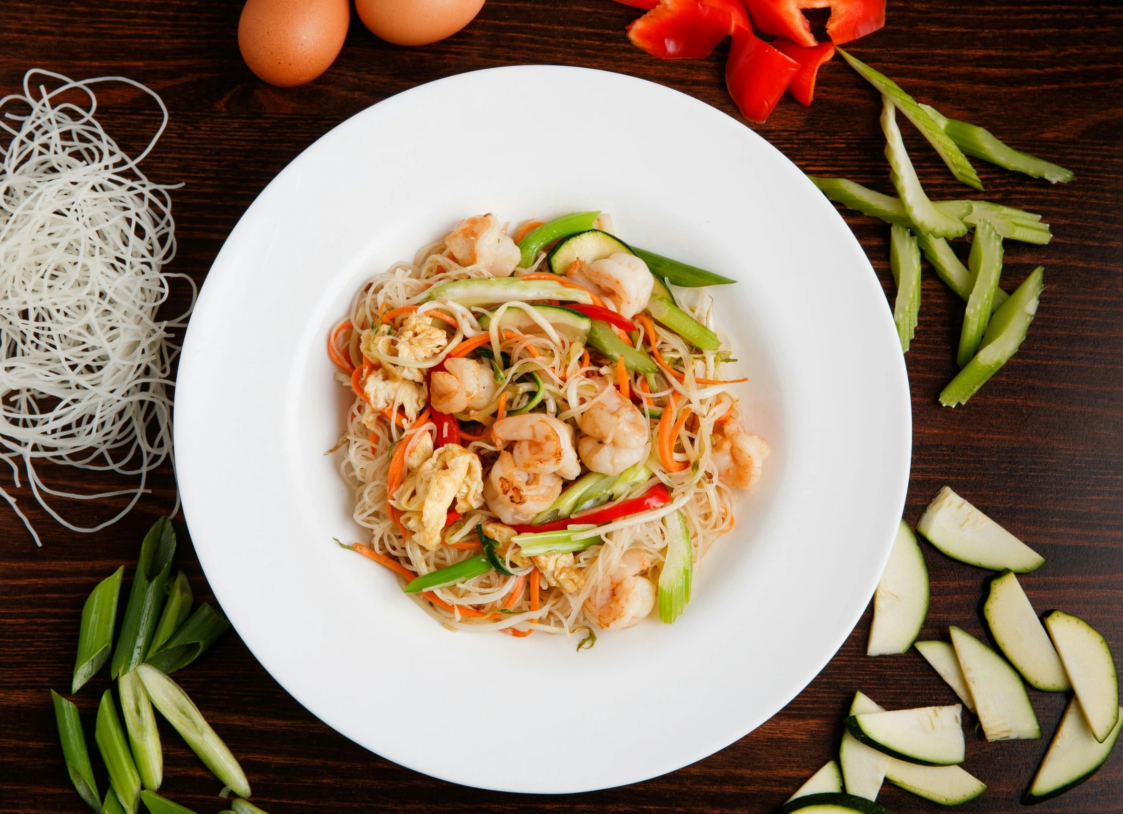 a white plate topped with noodles and vegetables, premium quality, fan favorite, full body image, prawn