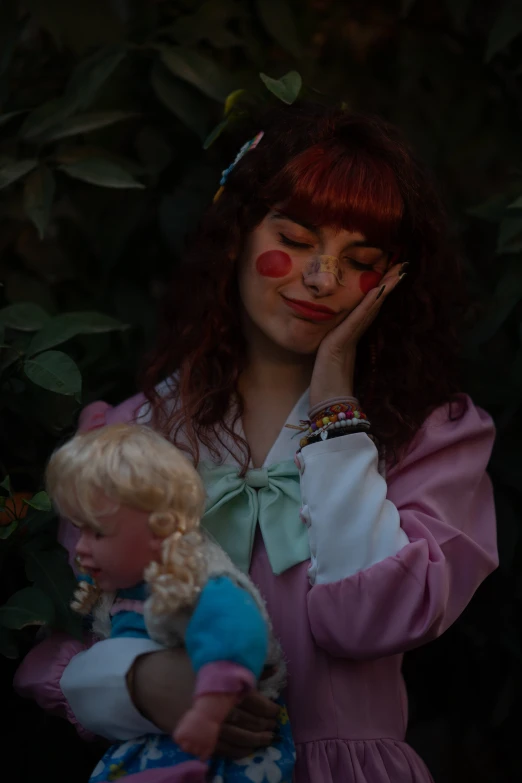 a woman in a pink dress holding a doll, an album cover, inspired by Elsa Bleda, pexels contest winner, magic realism, wearing accurate clown makeup, loish |, cottagecore hippie, profile image