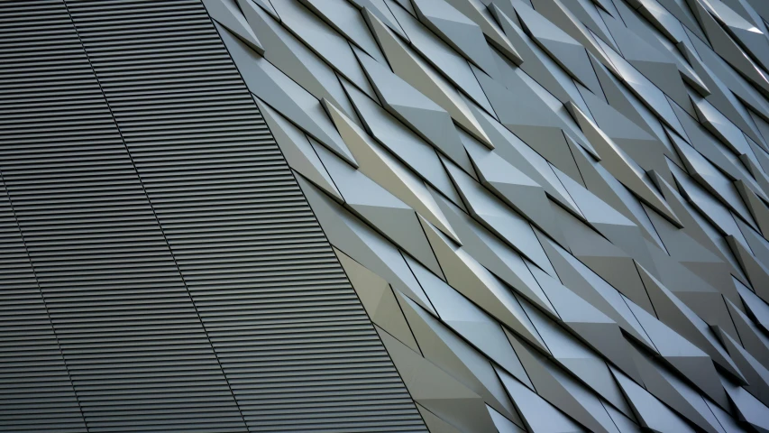 a close up of the side of a building, a digital rendering, pexels contest winner, angular metal, grey, titanic ship exterior, dynamic folds