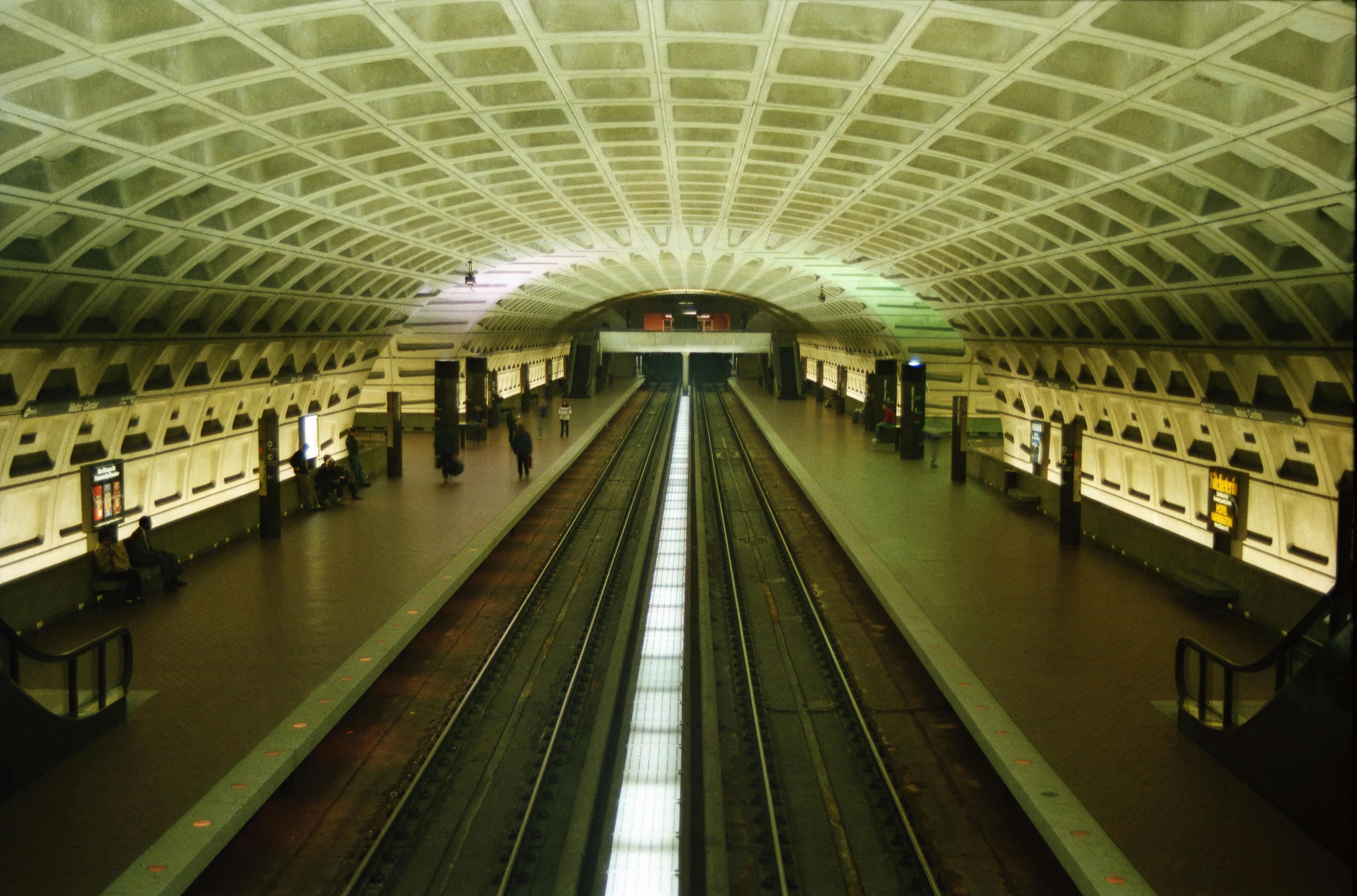 a train station with a train pulling into the station, flickr, op art, washington dc, getty images, underground metro, looking across the shoulder