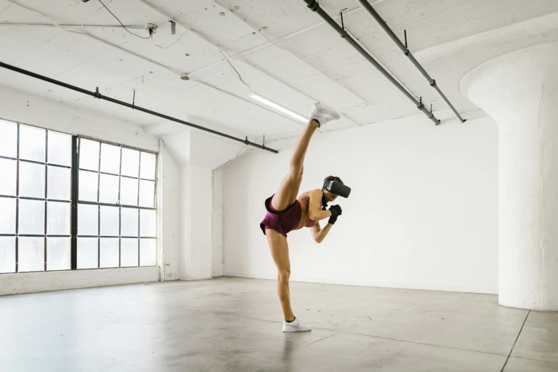 a woman doing a handstand in an empty room, a marble sculpture, by Nina Hamnett, unsplash, wrestlers wearing vr headsets, heroic muay thai stance pose, train with maroon, sydney hanson