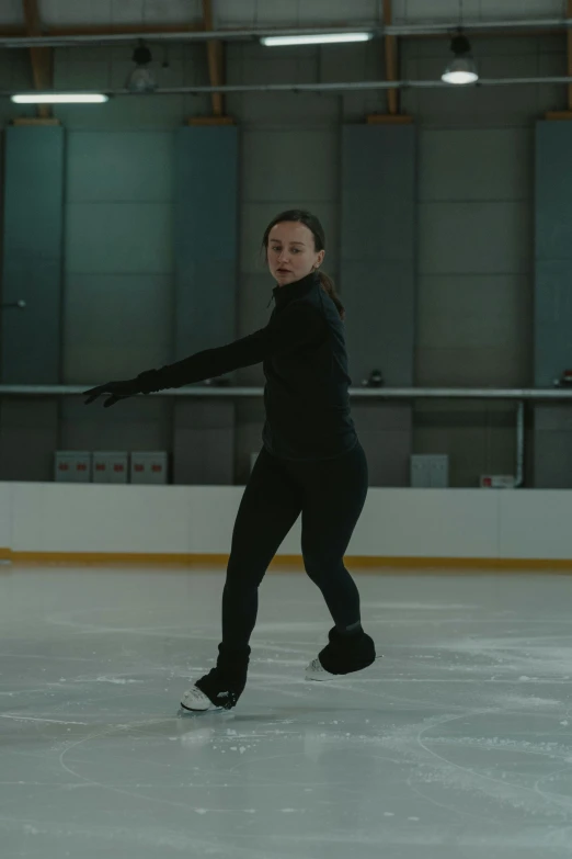 a woman is skating on an ice rink, a hologram, by Winona Nelson, arabesque, netflix, pulling the move'the banshee ', medium-shot, danila tkachenko