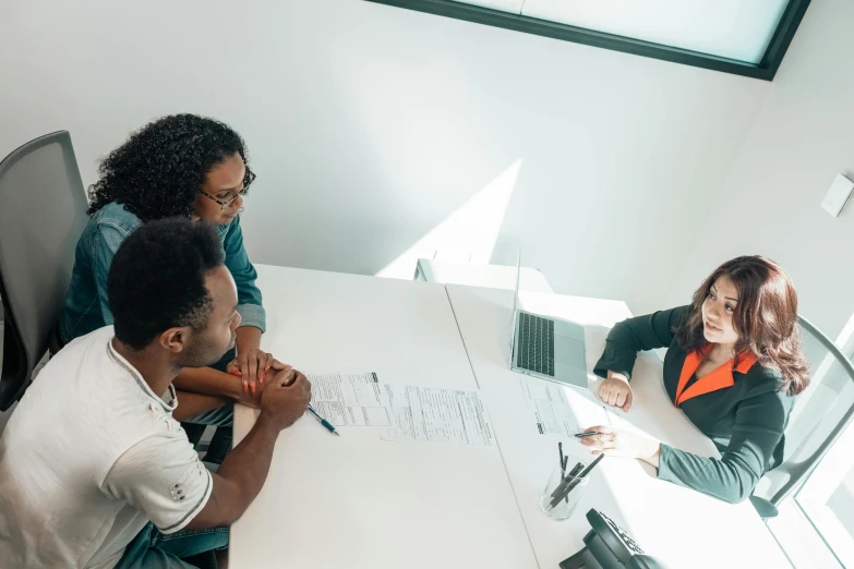 a group of people sitting around a white table, a photo, profile image, thumbnail, unedited, high quality image