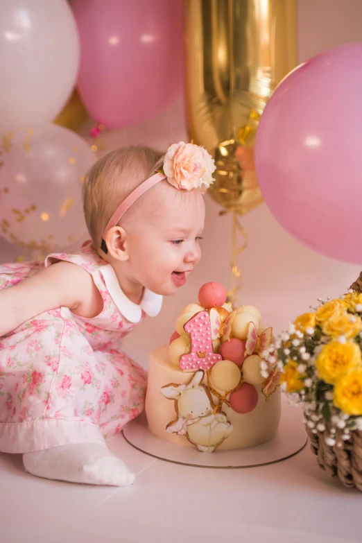a baby girl in a pink dress playing with a cake, pexels contest winner, happening, party balloons, profile image, flowers, yellow