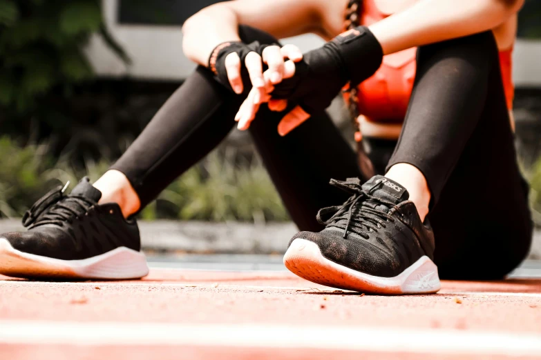 a close up of a person sitting on a tennis court, black and terracotta, athletic crossfit build, 🤬 🤮 💕 🎀, spinning hands and feet