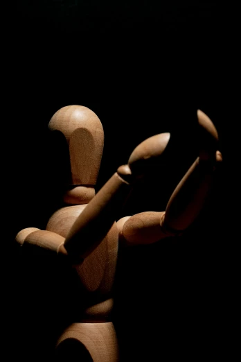 a wooden figure holding a baseball bat in the dark, an abstract sculpture, pixabay contest winner, hand gesture, taken in the late 2000s, articulated joints, dancer