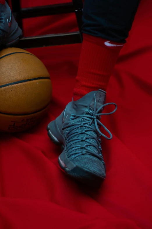 a pair of shoes sitting on top of a basketball ball, teal uniform, payne's grey and venetian red, detailed foot shot, slide show