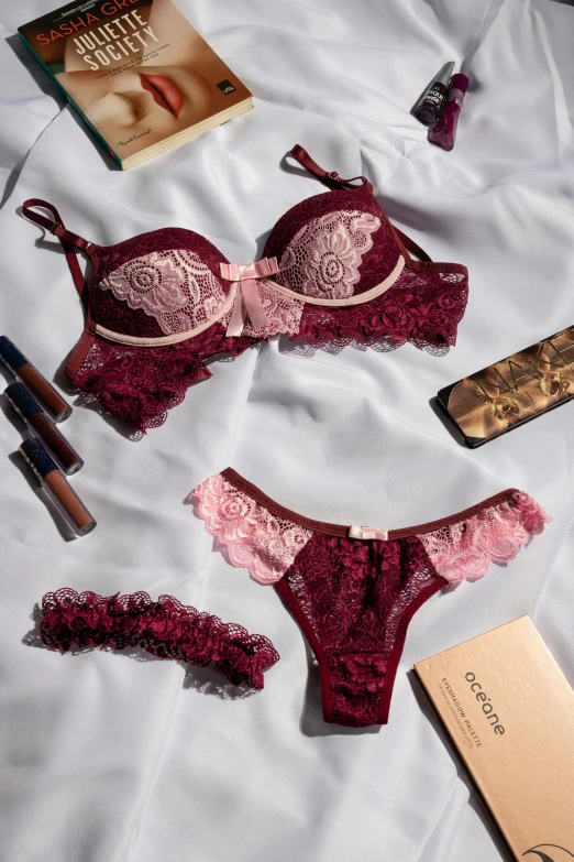 the contents of a woman's lingerie laid out on a bed, inspired by Emma Ríos, baroque, wine red trim, medium close up shot, boutinela bikini, dressed in a frilly ((lace))