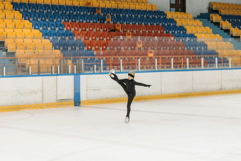 a man riding a skateboard on top of an ice rink, a picture, pexels contest winner, arabesque, wearing a track suit, inside a grand, irina nordsol kuzmina, empty background