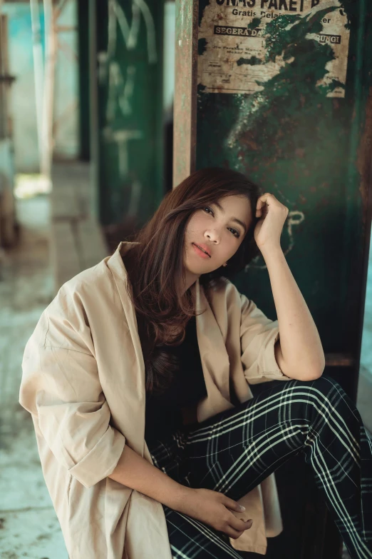 a woman sitting on the ground next to a wall, trending on pexels, beautiful asian woman sitting, 15081959 21121991 01012000 4k, malaysian, canvas