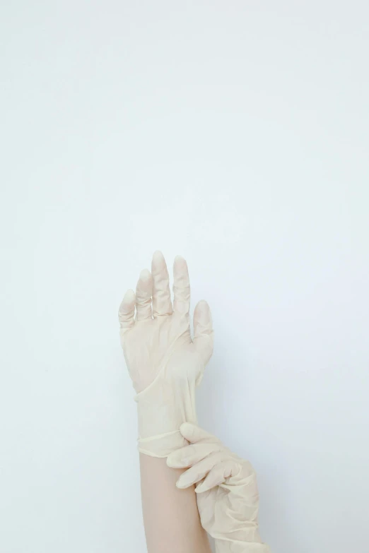 a person wearing a pair of latex gloves, an album cover, inspired by Elsa Bleda, unsplash, translucent white skin, surgical supplies, healthcare, ilustration