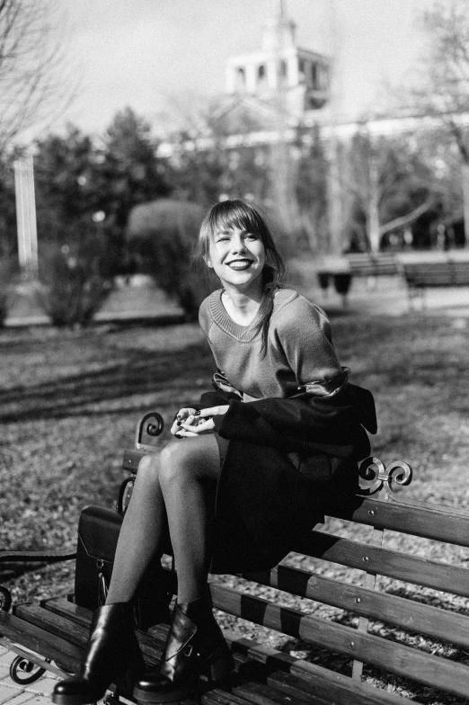 a black and white photo of a woman sitting on a bench, happy girl, 1996), pokimane, 🤤 girl portrait