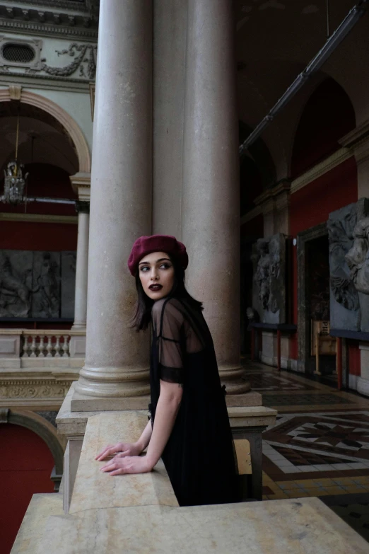 a woman standing on a ledge in a building, inspired by Jean-Jacques Henner, pexels contest winner, gothic art, wearing a french beret, inside a palace, melanie martinez, beautiful!!!! museum photo