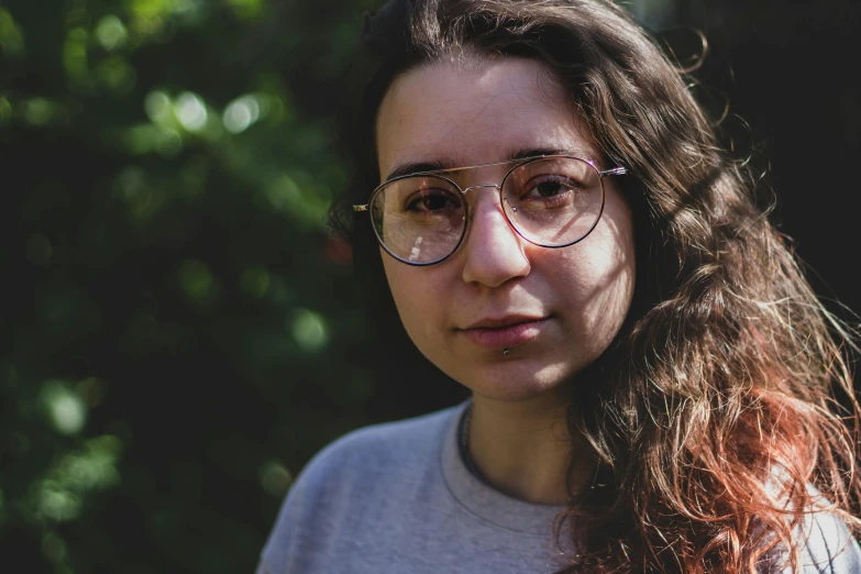 a close up of a person wearing glasses, inspired by Elsa Bleda, photorealism, avatar image, square rimmed glasses, portrait mode photo, student