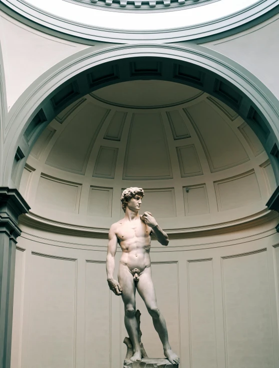 a statue that is inside of a building, inspired by Michaelangelo, trending on unsplash, mannerism, male model, instagram story, gay, museum background