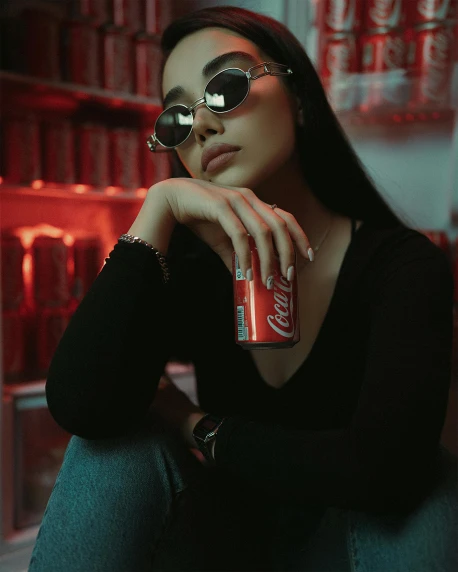 a woman sitting on the ground holding a can of coke, inspired by Elsa Bleda, trending on pexels, charli xcx, with sunglass, sitting on a store shelf, mai anh tran