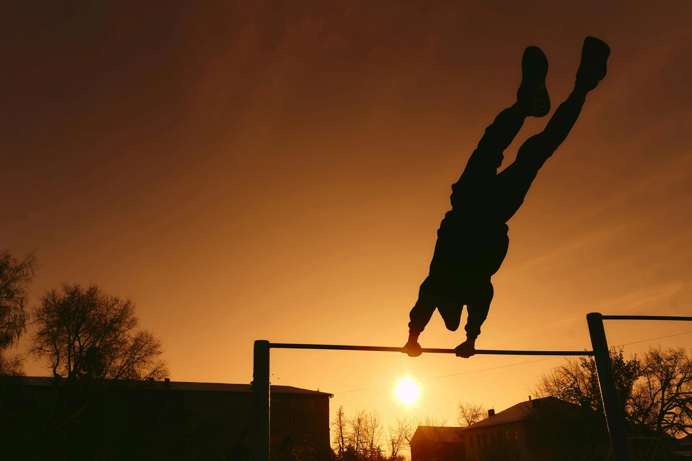 a silhouette of a person doing a trick on a pole, by Attila Meszlenyi, pexels contest winner, realism, athletic crossfit build, warm sunshine, schools, profile pic