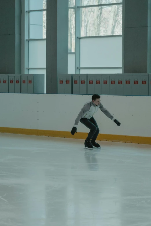 a man riding a skateboard on top of an ice rink, 8 k film still, indoor picture, filmstill, b - roll