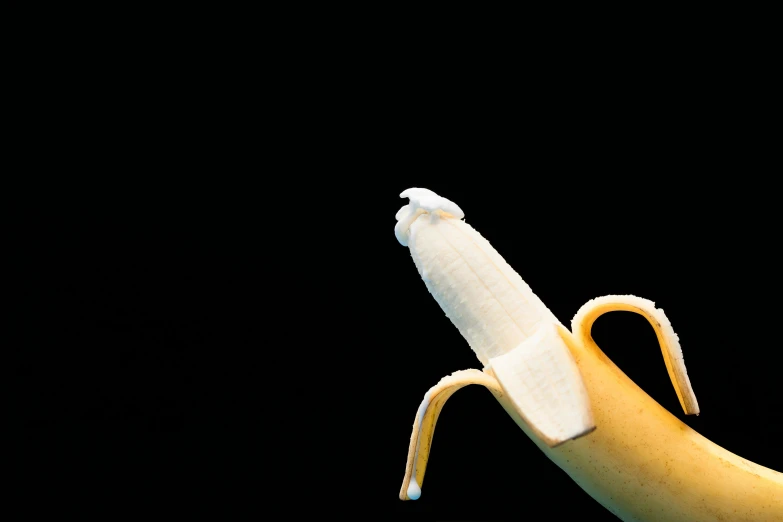 a banana with a bite taken out of it, inspired by Robert Mapplethorpe, trending on pexels, ivory carving, male art, contracept, micro art