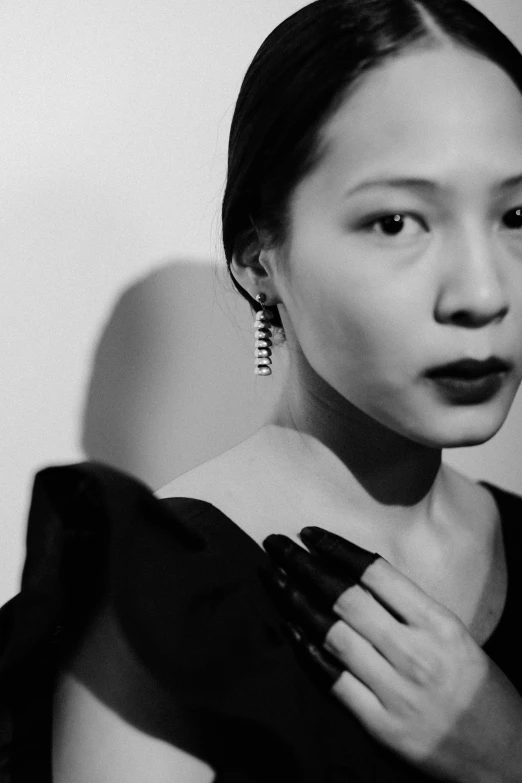 a black and white photo of a woman in a dress, inspired by Gao Cen, earrings, yuli ban, bella poarch, park ji-min