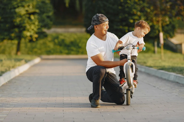 a man teaching a young boy how to ride a bike, pexels contest winner, avatar image, skatepark, father with child, blank