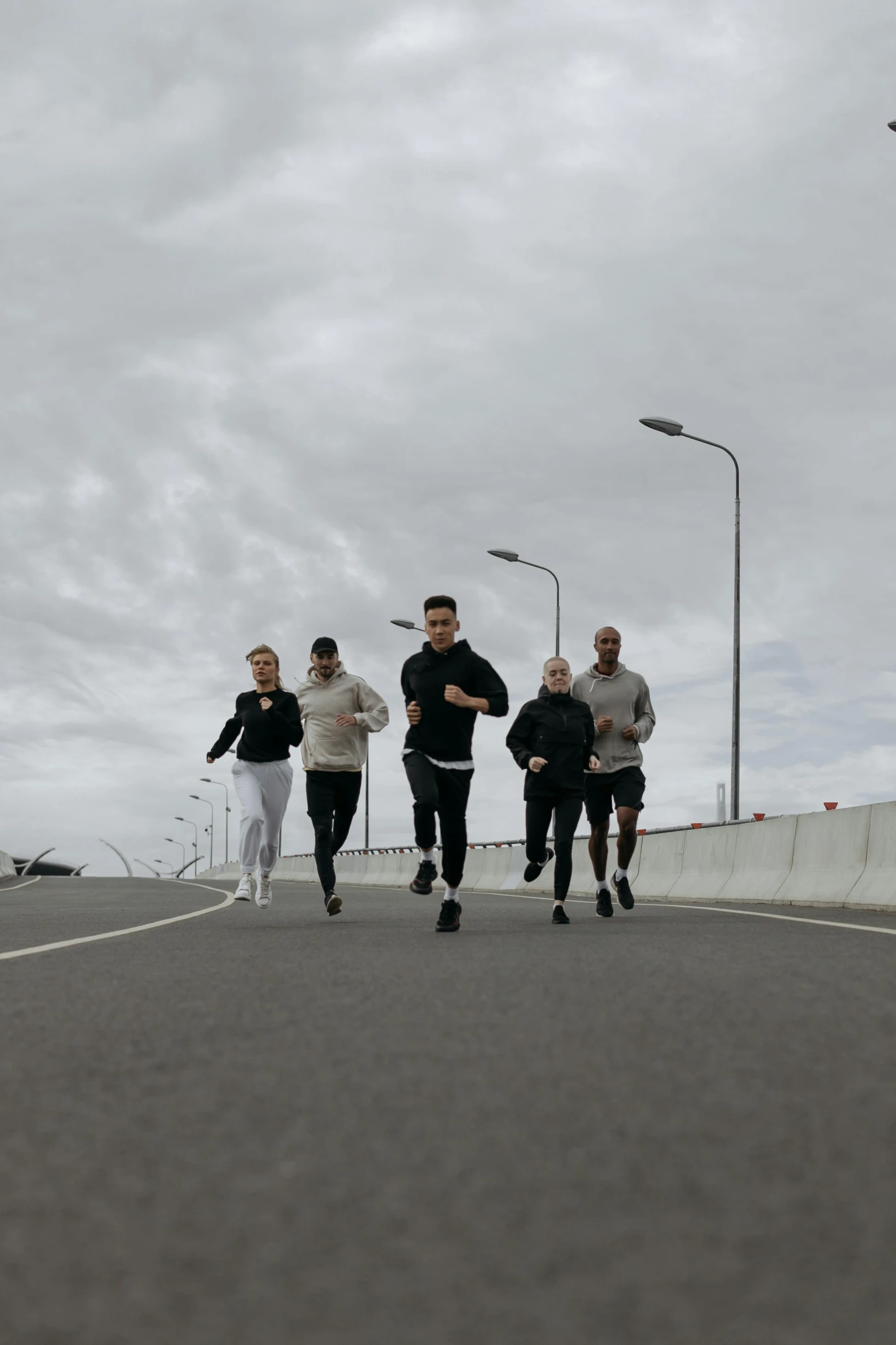 a group of people running down a road, by Vadym Meller, happening, espoo, die antwoord, working out, on ocean