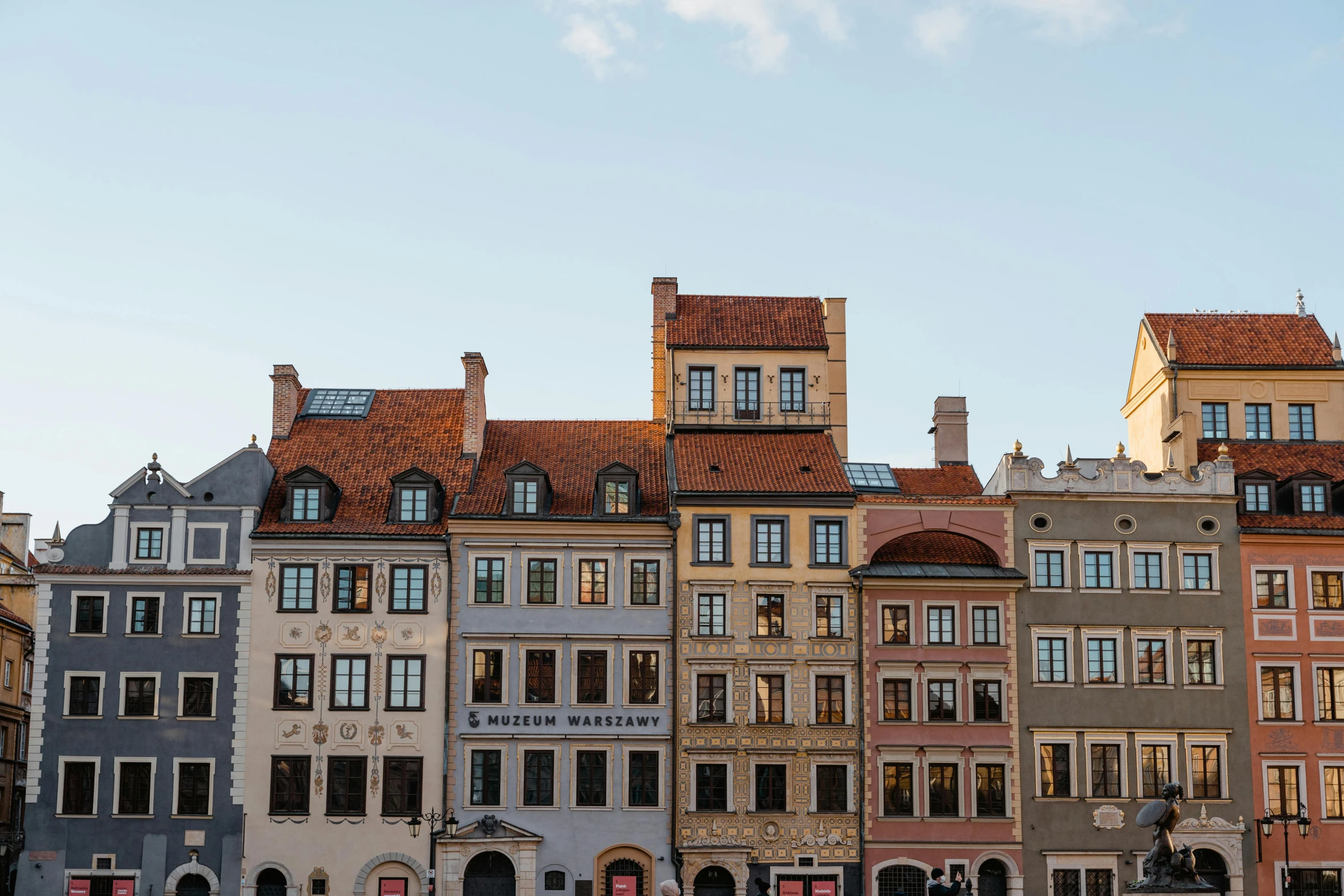 a group of buildings that are next to each other, by Emma Andijewska, unsplash contest winner, baroque, square, polish hyper - casual, warmly lit, sky line