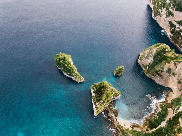 two small islands in the middle of a body of water, by Simon Marmion, pexels contest winner, renaissance, ocean cliff side, conde nast traveler photo, teaser, highly detailded
