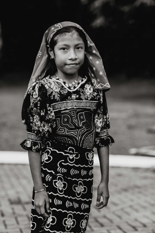 a black and white photo of a young girl, pexels contest winner, sumatraism, wearing inka clothes, slightly pixelated, mexican, medium format