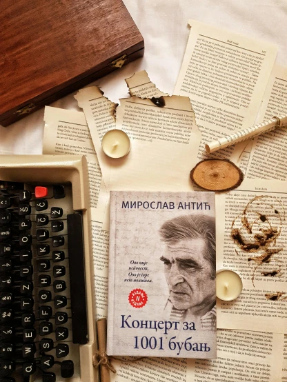 an old typewriter sitting on top of an open book, a portrait, inspired by Lev Lvovich Kamenev, 000 — википедия, instagram post, sovietwave aesthetic, come